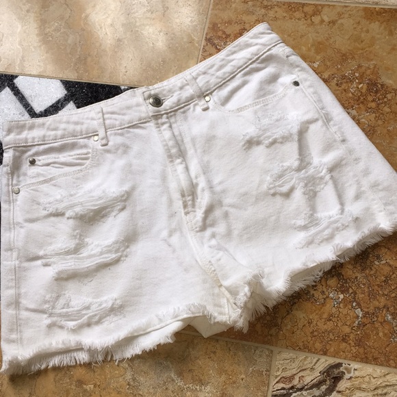white torn shorts